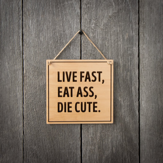 "Live Fast, Eat Ass, Die Cute" Hanging Sign