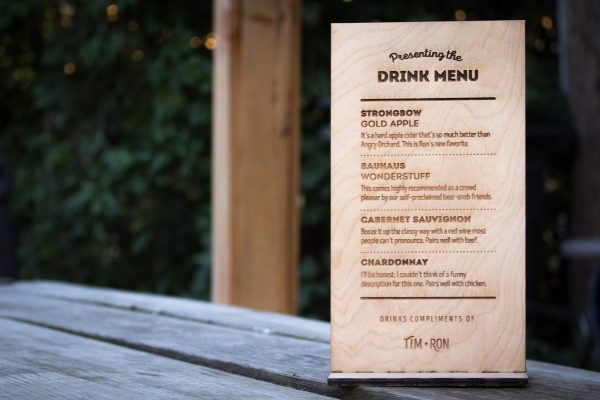 Laser etched wooden drink menu for the open bar at a wedding reception.